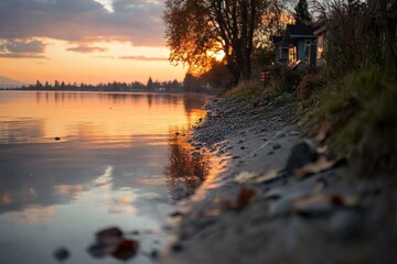 Wall Mural - Beautiful sunset reflected on calm lake with trees and shoreline in autumn