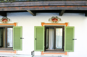 window and front door in an old house with white walls