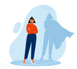 © Rudzhan - A vector illustration of a confident woman standing with arms crossed, her shadow reflecting a superhero with a cape. Concept of inner strength, empowerment, and self-confidence.