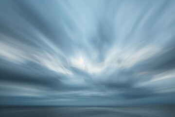Poster - Dynamic cloud movement over ocean at dusk highlights the beauty of nature's changing moods in a coastal landscape