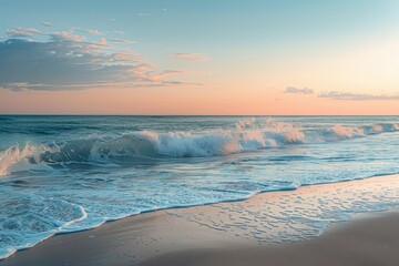 Aufkleber - Sunset over the ocean with waves crashing on the sandy beach in a tranquil coastal setting during early evening