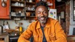 © Arifin Studio - Happy mature man smiling at camera in his kitchen.