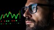 © Sirichai - The Analyst's Gaze: A close-up portrait of a focused man in glasses, gazing intently at a stock market chart with a determination to seize the moment.
