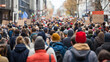 © pattozher - City Protest March: A sea of people march down a city street, their signs and backs to the camera creating a powerful image of collective action and social change.