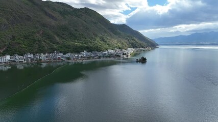 Poster - Stunning 4K aerial view of Erhai Lake in Dali, Yunnan, China.  A lakeside town nestled against mountains.