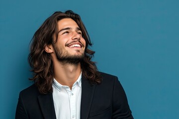 Canvas Print - Young handsome business man with long hair over isolated background looking away to side with smile on face, natural expression. Laughing confident. 