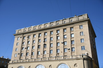 Architecture of old Soviet Union houses in Stalin's Empire style. Exterior of the facade of a vintage residential building in Russia