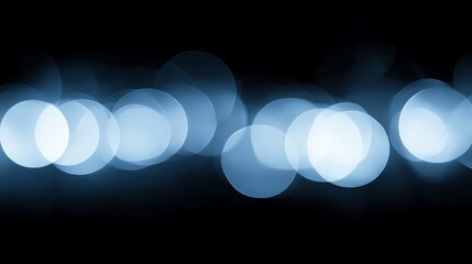 Poster - Blue bokeh lights on a dark background.
