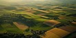 © Rasim - Aerial perspective of a farm captured from an airplane window, showcasing vibrant agricultural fields and landscapes typical of a farm in a picturesque setting. Enjoy this bird s eye view of a farm.