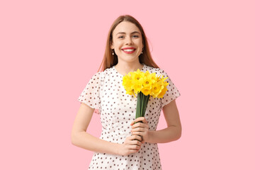 Sticker - Happy young woman with bouquet of daffodil flowers on pink background