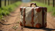 © lojorider - Rustic luggage with a canvas exterior and wooden handles  positioned on a dirt path in a farm
