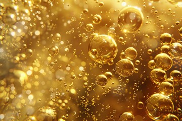 Poster - Golden bubbles floating in a transparent liquid, creating a festive and luxurious atmosphere