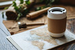 © masud - Vintage World Map with a Traveler's Coffee Cup