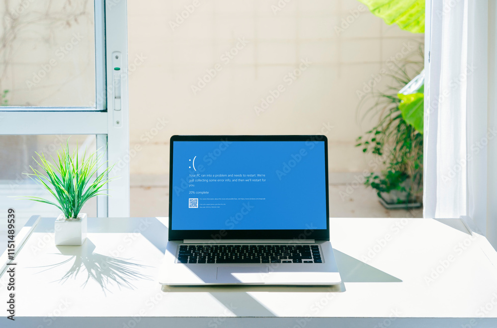 Laptop showing Blue screen of death or BSOD on the monitor screen ...
