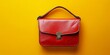 © Ahmad - Chic red leather purse displayed on a vibrant yellow background, showcasing a stylish design perfect for accessories lovers. This red leather purse combines elegance with a bold color contrast.