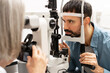 © Maria Vitkovska - Ophthalmologist taking photos of patient's eye with slit lamp