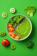 A vibrant smoothie bowl decorated with coral lettuce leaves.