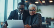 © GustavsMD - Focused Business Team Discussing Strategies in Office