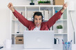 © nenetus - Successful businessman celebrating something while working with laptop in the home office