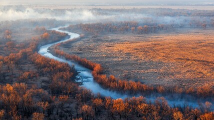 Wall Mural - River Winding Through Smoky Autumnal Landscape