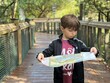 © Tamara Sales  - little boy reading a paper mapscavenger hunt