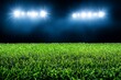© Thanyarat - A football field with fresh green turf under bright stadium lights, ready for an intense match