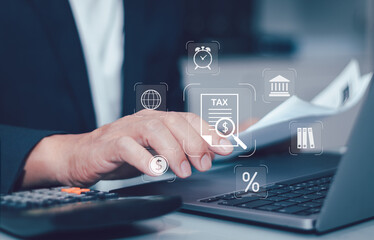 Finance or income concept ,calculating taxes online. Personal income statement, man is filling out personal or business income tax payment form for government agency on virtual computer screen