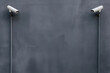 © Mselected - Surveillance cameras mounted on a gray wall provide security for the area