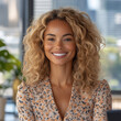 © Kripanath - Smiling African American Woman with Blonde Curly Hair in Office Setting