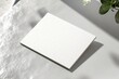 © Maria - mockup of blank business card with embossed edges placed on clean gray surface
