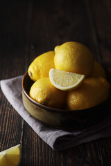 Wall Mural - A bowl with yellow bright lemons	