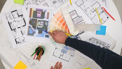 group of architects, creative interior designers and team members meeting in boardroom at desk, disc