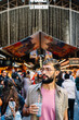 © Guillem de Balanzó - Tourist enjoying a refreshing drink at la boqueria market in barcelona