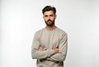 © Vibudhaart - A man with a beard and a neutral expression  arms crossed  stands against a white background.
