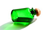 © SusDmi - Old-fashioned green transparent glass bottle for medicine, essential oil, empty container with a cork on the white background, silhouette