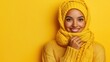 © Pixel Mind - Young woman wearing a cozy yellow sweater and scarf displays a joyful expression with a vibrant backdrop