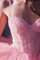 Sticker - A close-up view of a woman wearing a pink dress, suitable for beauty or fashion related uses