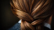© scaliger - Close-up of woman's brown hair in a neatly braided bun hairstyle with subtle highlights