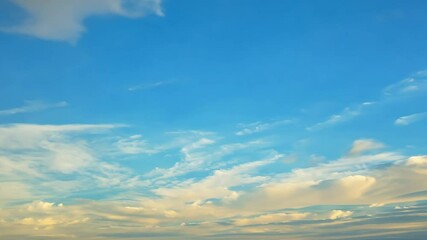 Wall Mural - Beautiful blue sky with clouds on bright sunny day for abstract background. White clouds moving towards the horizon.