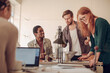 © Geber86 - Young people working on a project together in a startup company office