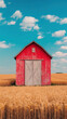 © Pisahouse - Facade, A vibrant red barn stands in a golden wheat field under a blue sky with fluffy clouds, capturing a serene rural landscape.