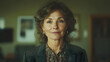 © wannee - A confident middle-aged woman in a professional setting, exuding warmth and intelligence with a subtle, engaging smile.