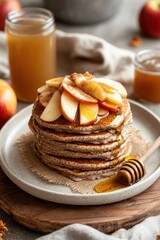 Poster - A stack of pancakes topped with apple slices and honey, served with apple juice.