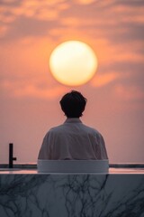 Poster - A person gazes at a sunset from a bathtub, creating a serene and contemplative atmosphere.