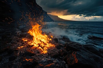 Poster - A vibrant fire burns on rocky shorelines as waves crash under a dramatic sky.