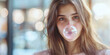 © VALUEINVESTOR - A young woman with long brown hair blowing a pink bubble gum, generative AI