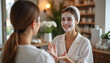 © Vera - Mask application: Close-up of the beautician's hands gently applying the mask to the client's face with a special brush.