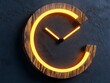 © prime stock - A stylish wooden clock featuring a glowing neon orange design, showcasing modern decor aesthetics against a dark textured background.