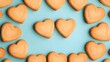 © terat - heart-shaped cookies on blue background - flatlay photography