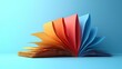 © Kepo - A vibrant book unfolds with pages in a spectrum of colors. Perfect for designs related to reading, learning, or creativity.
